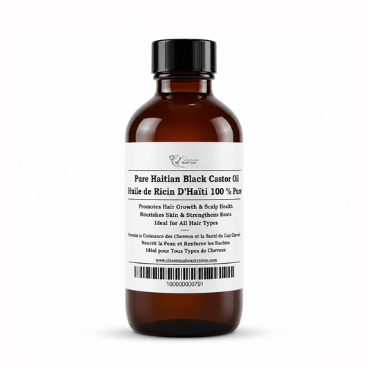 Brown bottle of Pure Haitian Black Castor Oil with a white label on a white background