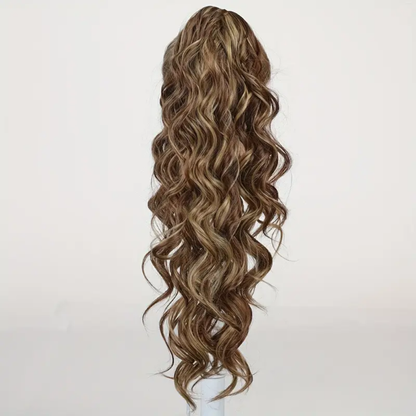 22-inch long wavy synthetic claw clip ponytail hair extension featuring highlighted brown to light brown tones for an instant voluminous and natural-looking hairstyle.