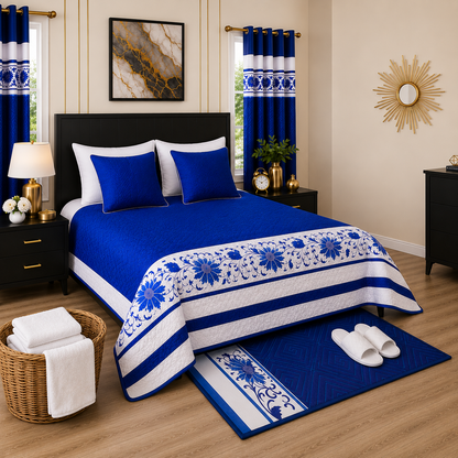 Bedroom with blue and white floral bedding, matching curtains, and decor.